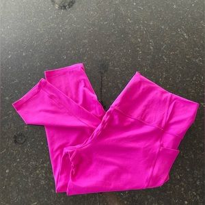 Athleta Salutation stash pocket II 7/8 Tight in electric fuschia